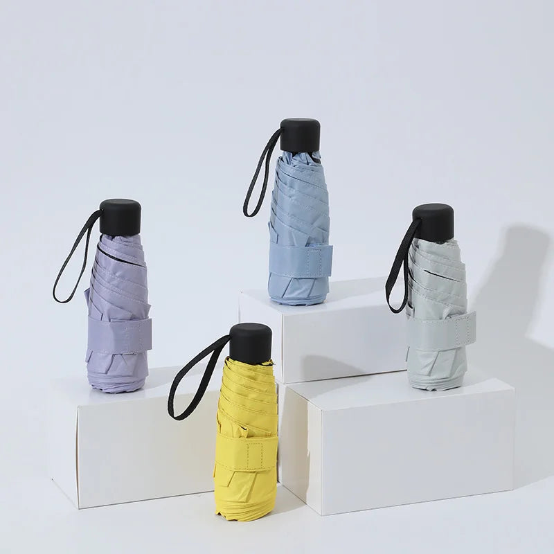 Ultraleve mini bolso feminino pequeno à prova de vento dobrável guarda-chuva viagem compacto chuva guarda-chuva protetor solar ao ar livre um